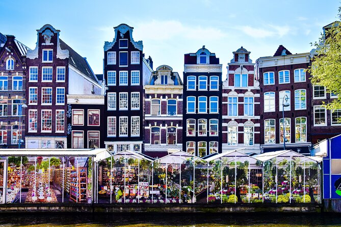 Amsterdam Day Trip from Brussels With Cheese, Clogs and Windmills - Amsterdam Arrival: Dam Square, the Palace Façade, and Quick Orientation