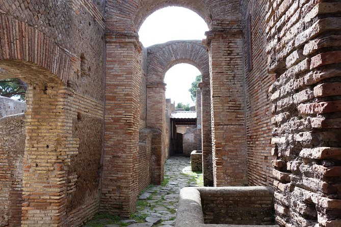 Ancient Ostia Antica Semi-Private Day Trip from Rome by Train with Guide - Baths of Neptune and mosaics: art you can actually see and understand