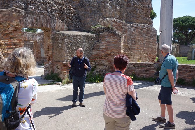 Ancient Ostia Antica Semi-Private Day Trip from Rome by Train with Guide - The amphitheater: the Roman crowd machine, scaled to real capacity