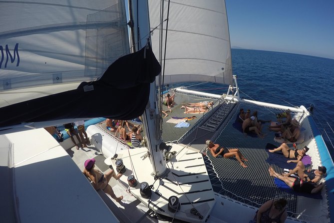 Catamaran Day Trip, Snorkeling & Sailing Excursion - The 75-foot catamaran ride: comfort, music, and crew energy