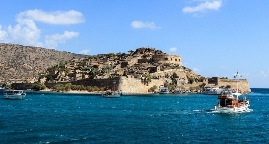 Crete: Day Trip to Agios Nikolaos and Spinalonga Island - Getting there and back: pickups, coaches, and the long tail of drop-offs