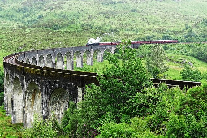 Edinburgh: Glenfinnan Viaduct, Glencoe & Fort William - Glenfinnan Viaduct and the Jacobite train crossing: the star moment