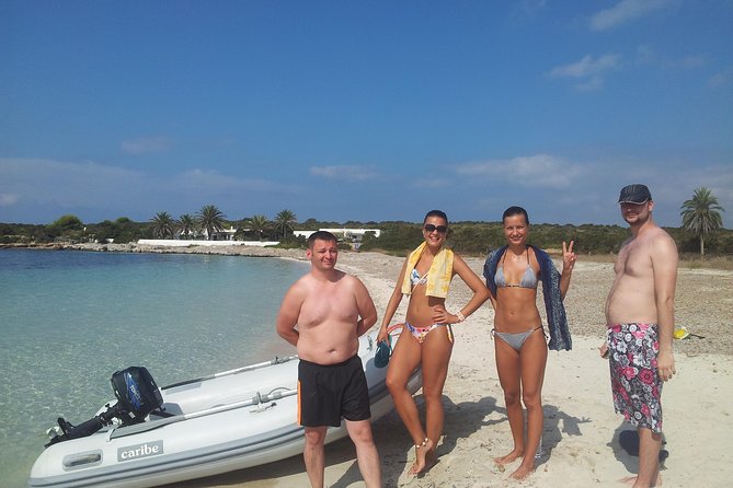 Formentera Day Trip from Ibiza on Private Luxury Catamaran - Meeting at Cala Jondal: captain, deck setup, and your first drinks