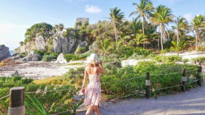 From Cancun: Day Trip to Tulum, Cenote & Playa del Carmen - Entering Tulum ruins with a guide: temples, fortresses, and sea views