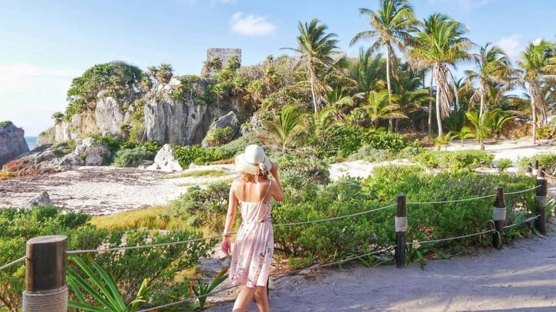 From Cancun: Day Trip to Tulum, Cenote & Playa del Carmen - Entering Tulum ruins with a guide: temples, fortresses, and sea views