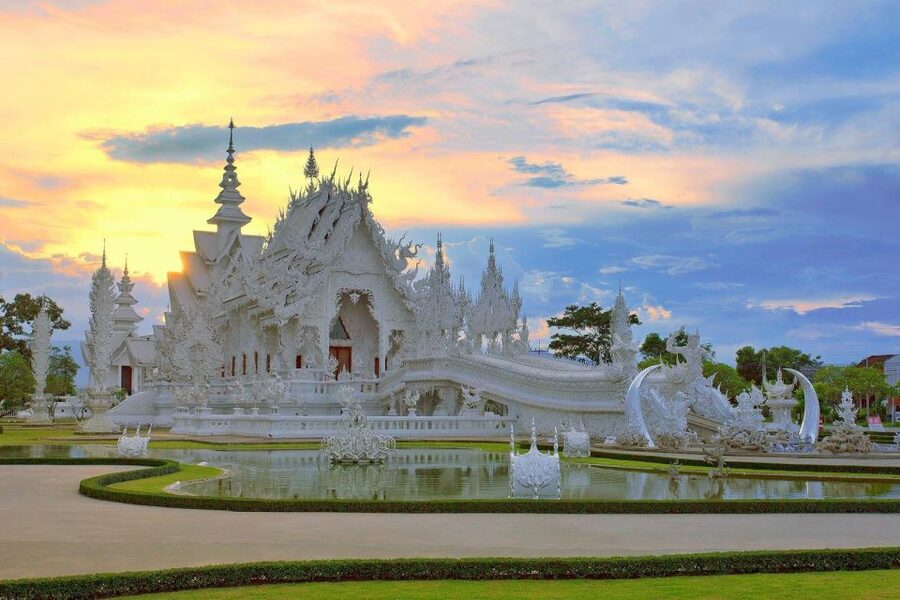 From Chiang Mai: Chiang Rai's Temples Exploration Day Trip - Wat Rong Suea Ten (Blue Temple): deep blue detail and a tiger-linked story