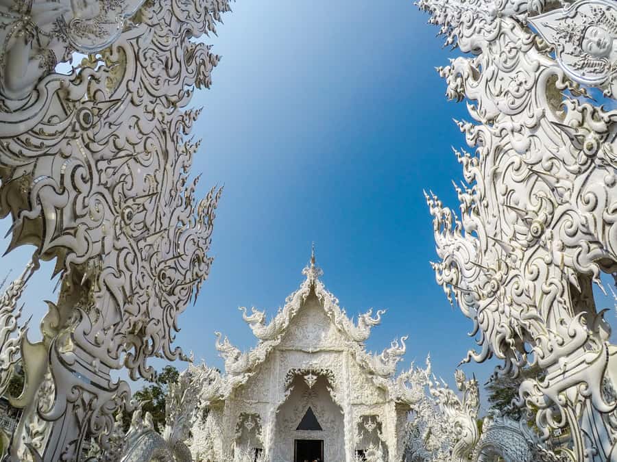 From Chiang Mai: White Temple & Golden Triangle Day Trip - Wat Rong Khun (White Temple): Mirrors, Meaning, and Crowd Reality