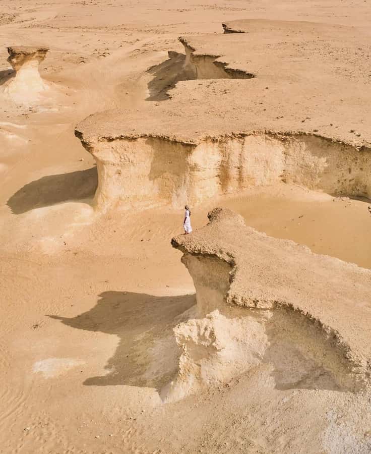 From Doha: Day Trip to North And West Qatar With Pickup - Jumail Abandoned Village: A Photo Stop With a Pulse