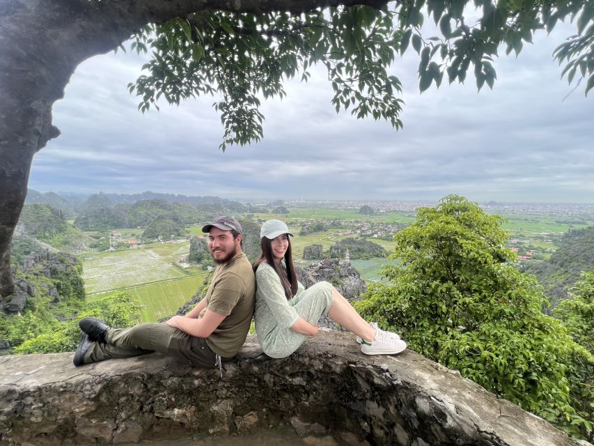 From Hanoi: Hoa Lu, Mua Cave and Tam Coc Full-Day Trip - Climbing Mua Caves for Tam Coc Panoramas (and Dealing With Rain)