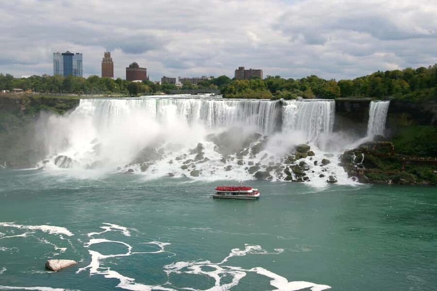 From Toronto: Early Bird Niagara Falls with Journey & Skylon - Journey Behind the Falls Tunnels: Walk Up Close to the Water Curtain
