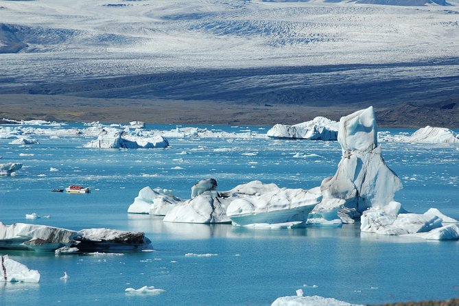 Guided Glacier Lagoon and Diamond Beach Day Trip from Reykjavik - Skógafoss: 60-Meter Waterfall Power and Photo-Friendly Mist
