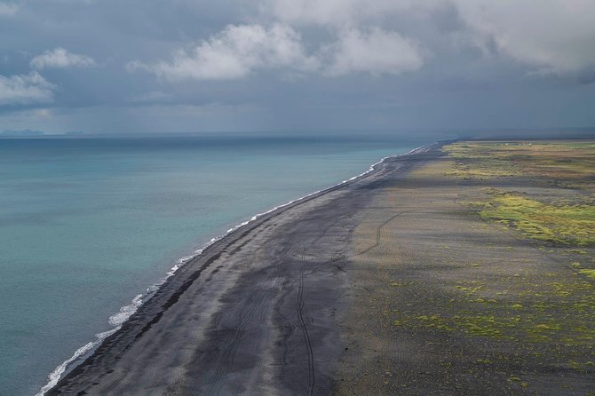 Iceland's South Coast Full Day Tour from Reykjavik - Stop 5: Reynisfjara black sand—basalt pillars and wind you can feel