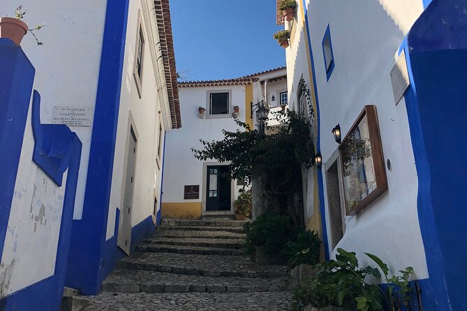Lisbon to Fatima/Batalha/Nazare & Obidos guided tour 8pax group - Óbidos medieval lanes and the chocolate-glass ginjinha