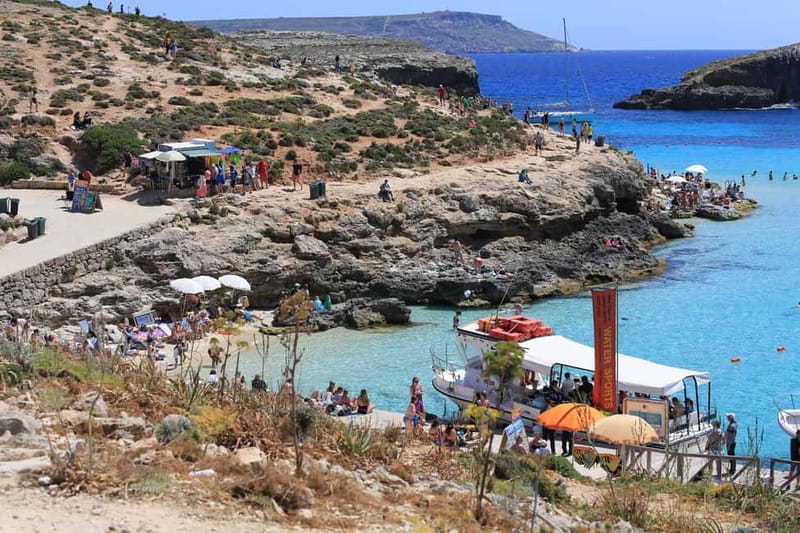 Malta: Comino, Blue Lagoon, + Sea Caves Day Trip - Santa Maria Caves and the rock formations: seeing the drama from water level