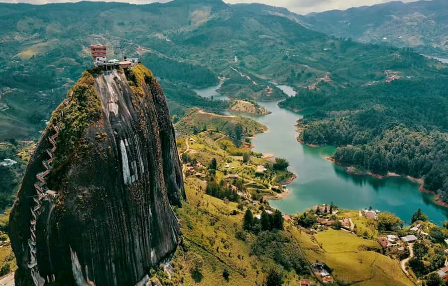 Medellin: Guatapé Day Trip & Boat to Pablo Escobar's Estate - Meeting point in El Poblado and the themed-bus vibe