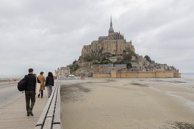 Mont Saint Michel Day Trip with Abbey Entrance from Paris - Fortifications du Mont-Saint-Michel: Ramparts, Shops, and Tide-Spotting