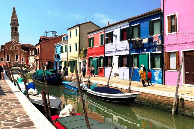 Murano and Burano half-day trip from Punta Sabbioni Jesolo - Onboard experience: covered cabin, guide info, and group pace