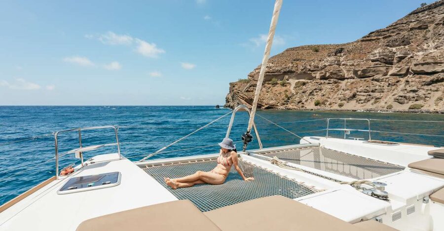 Santorini: Luxury Catamaran Day Trip with Meal and Open Bar - Key highlights worth planning around