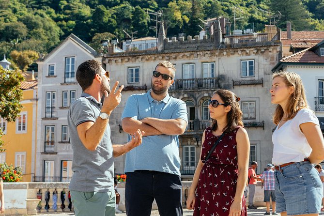 Sintra EXCLUSIVE Private Day Trip by Car with a Private Guide - Praia da Ursa: golden-sand beach time with rock character