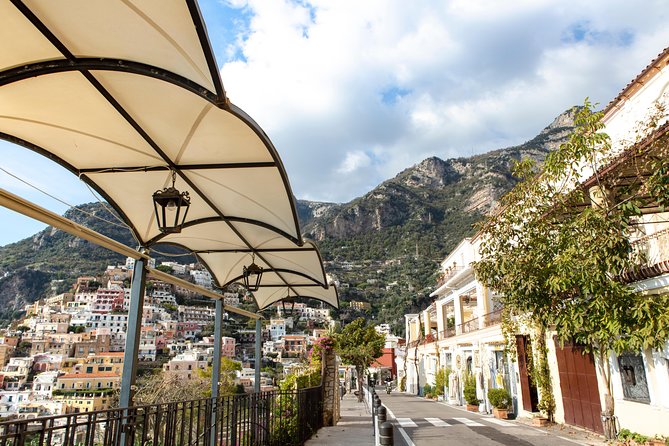 Sorrento and Amalfi Coast Small Group Day Trip from Naples - Positano in one hour: pastel cliffs, St Maria Assunta, and boutique time