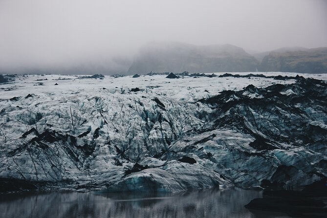 South Coast, Waterfalls and Black Sand Beach (Small Group Tour) - Stop 3: Vik for a Coastline View and a Church Stop