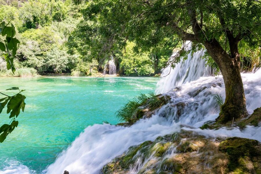 Split: Krka Waterfalls Guided Day Trip with Swim & Boat Tour - Inside Krka National Park: Trails, Waterfall Photos, and Easy Exploration